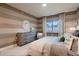 Comfortable bedroom featuring a large window, stylish dresser, and tasteful decor at 920 W 128Th Pl, Westminster, CO 80234