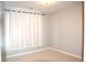 Spacious bedroom with neutral walls and carpeting at 804 Summer Hawk Dr # 9106, Longmont, CO 80504