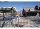 Community pool with covered seating and fenced area at 804 Summer Hawk Dr # 9106, Longmont, CO 80504