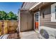 Backyard features a storage unit and red door at 1068 Milo Cir # A, Lafayette, CO 80026