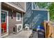 Cozy backyard with string lights, AC unit, and trash bins at 1068 Milo Cir # A, Lafayette, CO 80026
