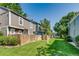 Backyard view of well-maintained grass and wood fence at 1068 Milo Cir # A, Lafayette, CO 80026