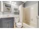 This bathroom has a shower, toilet, sink, vanity, and decorative shelving at 1068 Milo Cir # A, Lafayette, CO 80026