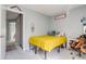 Youth bedroom with bright yellow quilt and decorative dream catcher wall hanging at 1068 Milo Cir # A, Lafayette, CO 80026