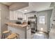 Efficient kitchen features white cabinets, wood countertops, and modern stainless steel appliances at 1068 Milo Cir # A, Lafayette, CO 80026