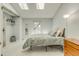 Bright main bedroom featuring vaulted ceilings, skylights, and a walk-in closet with shelving at 1068 Milo Cir # A, Lafayette, CO 80026