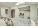 Main bedroom featuring vaulted ceilings, skylights, and a walk-in closet with shelving at 1068 Milo Cir # A, Lafayette, CO 80026