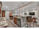 Finished basement area with a wet bar, barstool seating, and a TV area at 1091 Colt Cir, Castle Rock, CO 80109