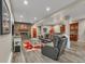 Basement rec room featuring a fireplace, bar area, and a leather sofa set at 1091 Colt Cir, Castle Rock, CO 80109