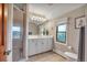 Bathroom featuring a glass enclosed shower and a vanity with white cabinetry at 1091 Colt Cir, Castle Rock, CO 80109