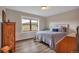 Bedroom with wood floors, neutral walls, and scenic views from the large windows at 1091 Colt Cir, Castle Rock, CO 80109