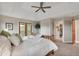 Main bedroom with private access to a balcony, carpet flooring, and neutral paint at 1091 Colt Cir, Castle Rock, CO 80109