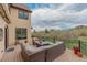 Large deck with outdoor seating area and beautiful views of nature at 1091 Colt Cir, Castle Rock, CO 80109