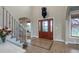 Elegant foyer boasts high ceilings, decorative tile, a grand staircase, and a stunning entryway at 1091 Colt Cir, Castle Rock, CO 80109