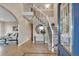 Grand foyer with staircase, tile flooring, and elegant decor. A glimpse into the home's luxurious living space at 1091 Colt Cir, Castle Rock, CO 80109