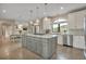 Large kitchen island with stainless steel appliances and tile flooring at 1091 Colt Cir, Castle Rock, CO 80109