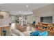 Large living room with wood floors, a vaulted ceiling, and plenty of natural light through large windows at 1091 Colt Cir, Castle Rock, CO 80109