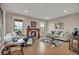 Bright living room features a fireplace, hardwood floors, and stylish decor with lots of natural light at 1091 Colt Cir, Castle Rock, CO 80109