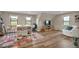 Open living room featuring hardwood floors, desk, entertainment center, and mountain views at 1091 Colt Cir, Castle Rock, CO 80109