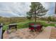 Brick patio features a barbecue grill, dining table, and scenic views at 1091 Colt Cir, Castle Rock, CO 80109