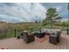 Relaxing outdoor seating on a wooden patio overlooking a beautiful backyard at 1091 Colt Cir, Castle Rock, CO 80109