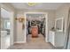 Spacious walk-in closet with custom shelving, drawers, and a view of the bathroom at 1091 Colt Cir, Castle Rock, CO 80109