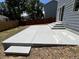 Large patio with new concrete, ideal for outdoor gatherings and enjoying the backyard space at 4178 E 94Th Pl, Thornton, CO 80229