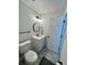 Well-lit bathroom with a round mirror and new toilet featuring modern fixtures and neutral décor at 4178 E 94Th Pl, Thornton, CO 80229
