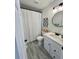 Well-lit bathroom with a shower, a modern vanity, and updated fixtures at 4178 E 94Th Pl, Thornton, CO 80229