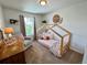Welcoming bedroom with a day bed, comfortable furniture, and a window view at 4178 E 94Th Pl, Thornton, CO 80229