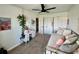 Bright bedroom with a day bed, a ceiling fan, and organized closet at 4178 E 94Th Pl, Thornton, CO 80229