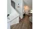 Inviting entryway featuring hardwood floors, a staircase, and a view into the living room at 4178 E 94Th Pl, Thornton, CO 80229