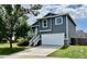 Charming two-story home features a well-manicured lawn, a two-car garage, and a front porch with lovely curb appeal at 4178 E 94Th Pl, Thornton, CO 80229