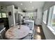Bright kitchen featuring white cabinetry, stainless steel appliances, a central island, and hardwood floors for style and functionality at 4178 E 94Th Pl, Thornton, CO 80229