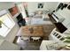 Loft room with rustic table and a comfortable seating arrangement, perfect for relaxing or entertaining guests at 4178 E 94Th Pl, Thornton, CO 80229