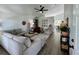 Bright and spacious living room featuring hardwood floors, vaulted ceilings, and stylish, comfortable seating and decor at 4178 E 94Th Pl, Thornton, CO 80229