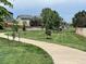 View of the neighborhood with a walking path and a green space at 4178 E 94Th Pl, Thornton, CO 80229