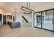 A modern living room features an island, a staircase and lots of natural light at 1210 W 144Th Ct, Westminster, CO 80023