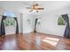 Bedroom with hardwood floors, large windows, and natural light at 5939 S Skyline Dr, Evergreen, CO 80439