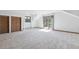 Carpeted bedroom with a sliding glass door leading to a balcony at 5939 S Skyline Dr, Evergreen, CO 80439