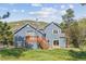 Home exterior featuring a wooden deck, offering a tranquil retreat amidst nature's beauty at 5939 S Skyline Dr, Evergreen, CO 80439