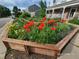 Landscaped front yard with colorful flowers and hexagonal planter at 311 Berthoud Way, Golden, CO 80401