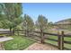 Charming backyard with a wooden fence, brick-paved patio, and well-maintained lawn at 389 Smith Cir, Erie, CO 80516