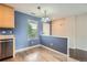 Dining area with modern lighting, a window, and adjacent to kitchen at 389 Smith Cir, Erie, CO 80516