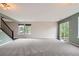 Spacious, light-filled living room with a sliding glass door to the backyard at 389 Smith Cir, Erie, CO 80516