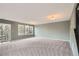 A bright living room featuring carpet and ample windows for plenty of natural light at 389 Smith Cir, Erie, CO 80516
