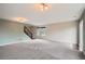 Spacious living room with plush carpet, neutral paint, and ample natural light at 389 Smith Cir, Erie, CO 80516
