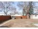 Expansive backyard featuring a play structure and sheds, offering plenty of space at 4571 Beach Ct, Denver, CO 80211