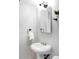 Stylish powder room with a modern sink, sleek mirror, and contemporary black fixtures at 4571 Beach Ct, Denver, CO 80211