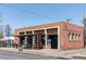 Exterior of brick building featuring a rustic wooden facade and an awning-covered patio at 4571 Beach Ct, Denver, CO 80211